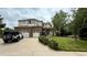 Charming two-story home with brick accents, a three-car garage, and a well-manicured front yard at 7858 Oban Ct, Lone Tree, CO 80124