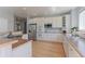 Well-appointed kitchen featuring stainless steel appliances, ample counter space, and bright, white cabinets at 7858 Oban Ct, Lone Tree, CO 80124