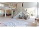 Spacious living area featuring a grand staircase and an open layout, perfect for entertaining at 7858 Oban Ct, Lone Tree, CO 80124
