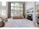Open living space filled with natural light, highlighted by large windows and comfortable furnishings at 7858 Oban Ct, Lone Tree, CO 80124