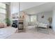Cozy living area with a fireplace, large windows, and stylish furnishings creating a relaxing atmosphere at 7858 Oban Ct, Lone Tree, CO 80124