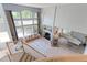 Open-concept living room features a fireplace, large windows, and comfortable seating at 7858 Oban Ct, Lone Tree, CO 80124
