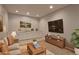 Inviting living area with a wet bar, sleek TV setup, and comfortable seating at 7858 Oban Ct, Lone Tree, CO 80124