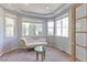 Light-filled sitting room with decorative ceilings, bay windows, and stylish furnishings at 7858 Oban Ct, Lone Tree, CO 80124