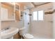 Bright bathroom featuring a new vanity, sink, and decorative tiled shower at 261 Linda Ln, Denver, CO 80221
