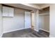Bedroom featuring neutral walls, carpet, and a convenient closet system for storage at 261 Linda Ln, Denver, CO 80221