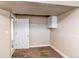 Bedroom featuring neutral paint, carpet, and lighting plus an entry at 261 Linda Ln, Denver, CO 80221