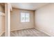 Bedroom with carpet flooring, a window, and neutral colored paint on the walls at 261 Linda Ln, Denver, CO 80221