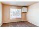 Cozy bedroom with ample natural light and neutral decor at 261 Linda Ln, Denver, CO 80221