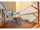 Covered patio area with outdoor seating and an outdoor dining area at 4713 Perth St, Denver, CO 80249