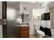 The bathroom has a shower-tub combo and a wood vanity at 4713 Perth St, Denver, CO 80249