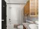 Bright bathroom features a shower over the tub with storage above the toilet at 4713 Perth St, Denver, CO 80249