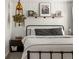 This bedroom has a comfortable queen size bed, small closet, and bedside table at 4713 Perth St, Denver, CO 80249