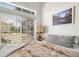 Bright bedroom with a large window and a cozy, inviting bed at 4713 Perth St, Denver, CO 80249