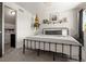 This bedroom features neutral walls and carpet along with modern decor at 4713 Perth St, Denver, CO 80249