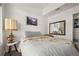 This bedroom features neutral walls and carpet along with modern decor at 4713 Perth St, Denver, CO 80249
