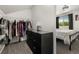 Bedroom closet has lots of storage and built-ins next to dresser and bedroom at 4713 Perth St, Denver, CO 80249