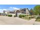 Lovely home with a two-car garage and lush green lawn at 4713 Perth St, Denver, CO 80249