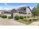 Beautiful home with a two-car garage, manicured lawn, and inviting curb appeal at 4713 Perth St, Denver, CO 80249