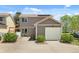 Home exterior featuring a well-manicured lawn and convenient two-car garage at 4713 Perth St, Denver, CO 80249