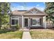 Charming single-Gathering home features a well-maintained lawn, inviting facade, and appealing landscaping at 4713 Perth St, Denver, CO 80249