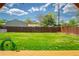 Well manicured backyard and lawn with wooden fence at 1035 Quartz St, Golden, CO 80401
