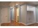 Finished basement with an open closet, a barn door to a bathroom, and hardwood floors at 1035 Quartz St, Golden, CO 80401