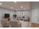 Virtual staging of basement living room features modern furniture and a neutral color palette at 1035 Quartz St, Golden, CO 80401