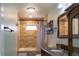 Well-lit bathroom features tile surround, a bathtub with shower, and a vanity with a mirror at 1035 Quartz St, Golden, CO 80401
