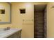 Bathroom featuring a gray tiled shower, modern fixtures and a gray marble countertop at 1035 Quartz St, Golden, CO 80401