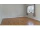 Spacious bedroom with hardwood floors and ample natural light from a large window at 1035 Quartz St, Golden, CO 80401