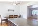 Bright dining area with wood floors, a ceiling fan, and a view to another room at 1035 Quartz St, Golden, CO 80401