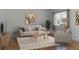 Bright living room featuring modern furniture, neutral tones, and a large window at 1035 Quartz St, Golden, CO 80401