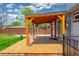 Covered patio with wooden deck and view of backyard at 1035 Quartz St, Golden, CO 80401