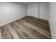 Finished basement with modern flooring and white trim at 16425 E 17Th Pl # A, Aurora, CO 80011