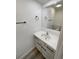 The bathroom has a white vanity, a large mirror, and modern black fixtures at 16425 E 17Th Pl # A, Aurora, CO 80011