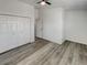 This bedroom shows a closet with white doors and modern flooring at 16425 E 17Th Pl # A, Aurora, CO 80011