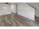 Bright living room with wood-look floors and a white wall at 16425 E 17Th Pl # A, Aurora, CO 80011