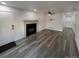 Open living room with sleek floors, a modern fireplace, and recessed lighting, perfect for entertaining at 16425 E 17Th Pl # A, Aurora, CO 80011