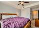 Bedroom with a dark wood bedframe, carpeted floors, and a ceiling fan at 9019 E Panorama Cir # D207, Englewood, CO 80112