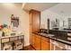 Granite countertops, stainless steel sink, and ample cabinet space in the kitchen at 9019 E Panorama Cir # D207, Englewood, CO 80112