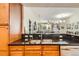 Kitchen sink and bar area overlooking the living room at 9019 E Panorama Cir # D207, Englewood, CO 80112