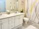 Bright bathroom featuring a double vanity and decorative accents at 9390 W Chatfield Pl # 103, Littleton, CO 80128