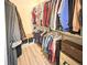 Walk-in closet with organization system, shelves, and plenty of hanging space at 9390 W Chatfield Pl # 103, Littleton, CO 80128