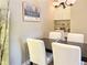 Cozy dining space with a black table, seating for four, and a built-in desk nook at 9390 W Chatfield Pl # 103, Littleton, CO 80128