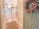 Inviting foyer with a view into the kitchen and dining area, showcasing the open floor plan at 9390 W Chatfield Pl # 103, Littleton, CO 80128