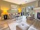 Relaxing living room features a sliding glass door and comfortable neutral furniture at 9390 W Chatfield Pl # 103, Littleton, CO 80128