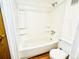 Clean and functional bathroom with tub and shower combo, and white tile surround at 14720 E Kentucky Dr # 611, Aurora, CO 80012