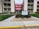 Well-maintained apartment building with visible address signage and landscaping at 14720 E Kentucky Dr # 611, Aurora, CO 80012