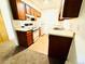 Cozy kitchen features wood cabinets, white appliances, and laminate countertops for a traditional feel at 14720 E Kentucky Dr # 611, Aurora, CO 80012